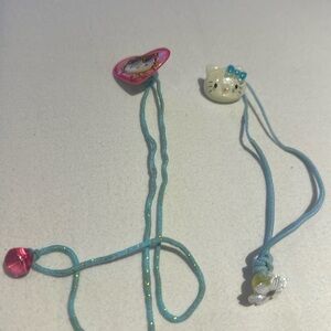 Hello kitty hair elastics but the elastics are worn. The charms are cute.